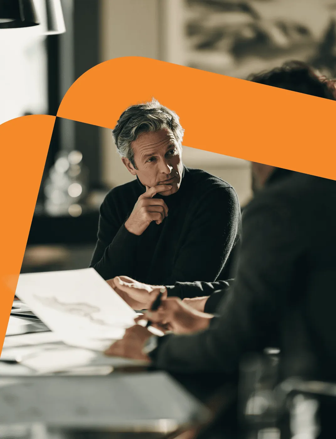 A consultant listening thoughtfully during a working session