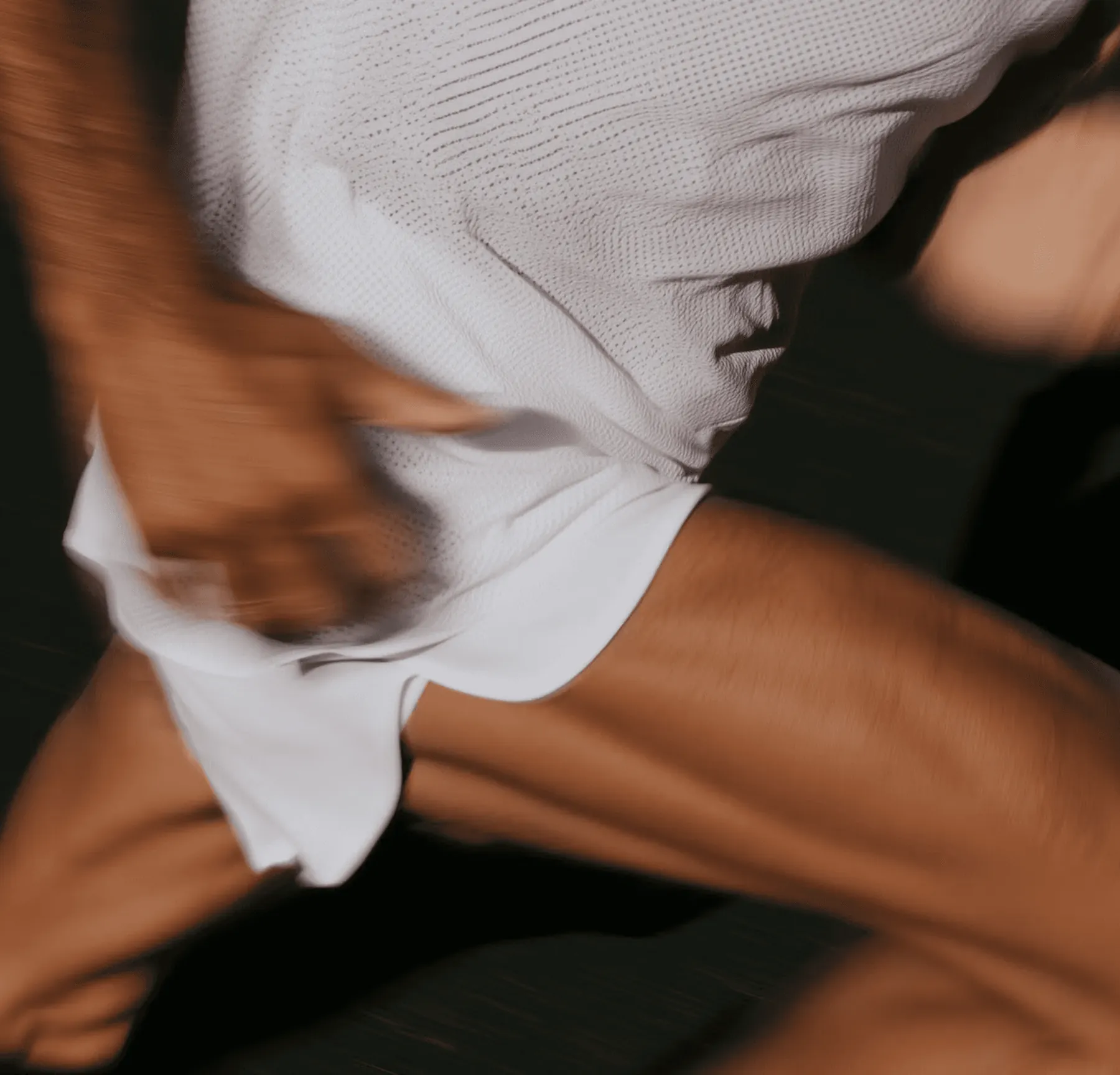 Motion-blurred close-up of a person in white clothing, Haven & Co. furniture e-commerce store project