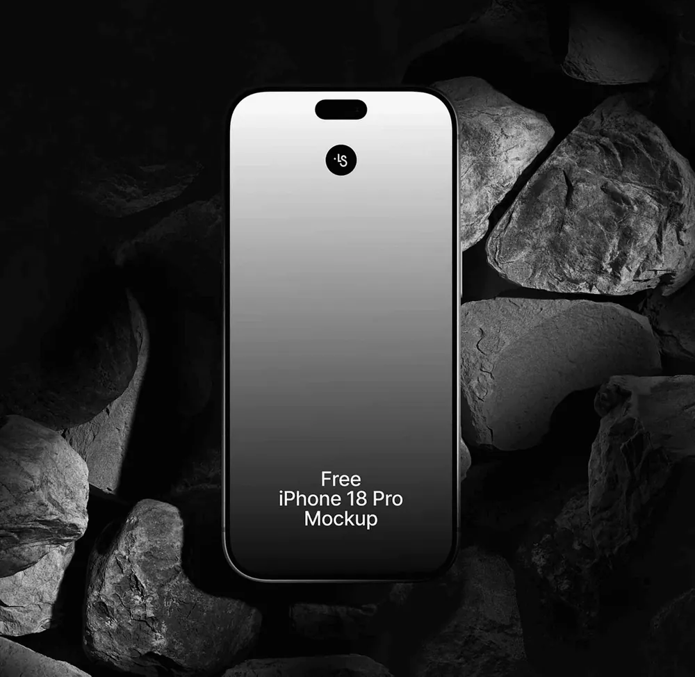Smartphone with a black and white gradient screen among dark rocks