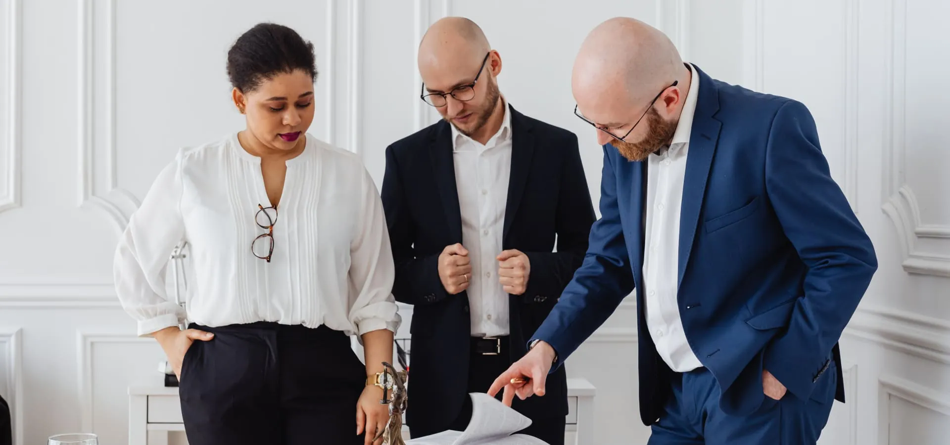 Colleagues talking in a bright office