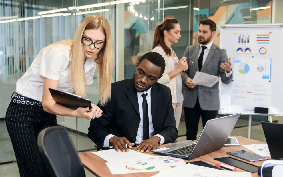 A team going over charts in a meeting room