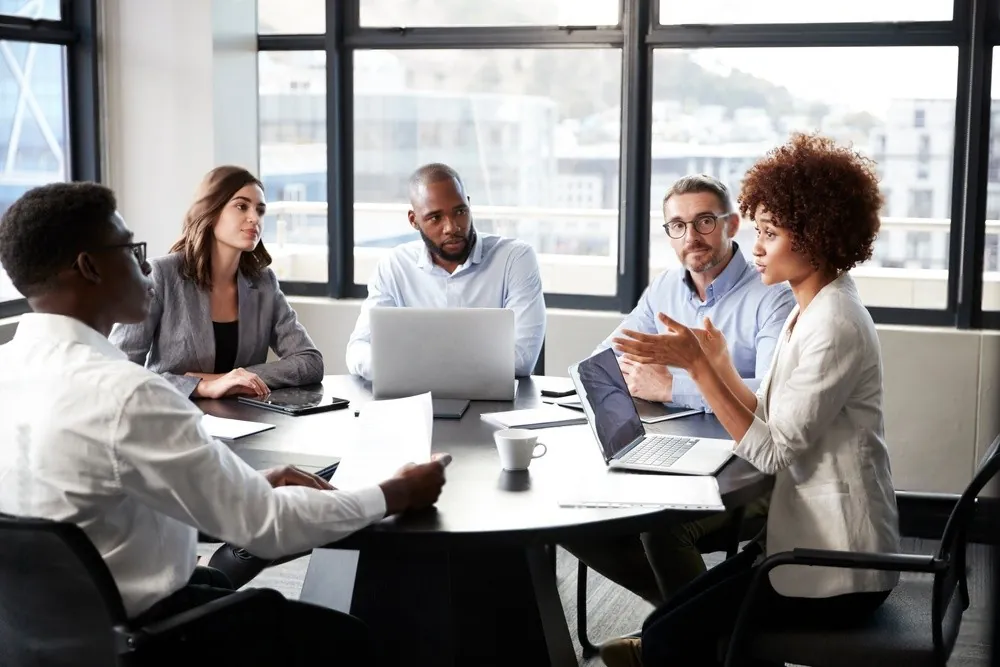 A team discussing work around a table