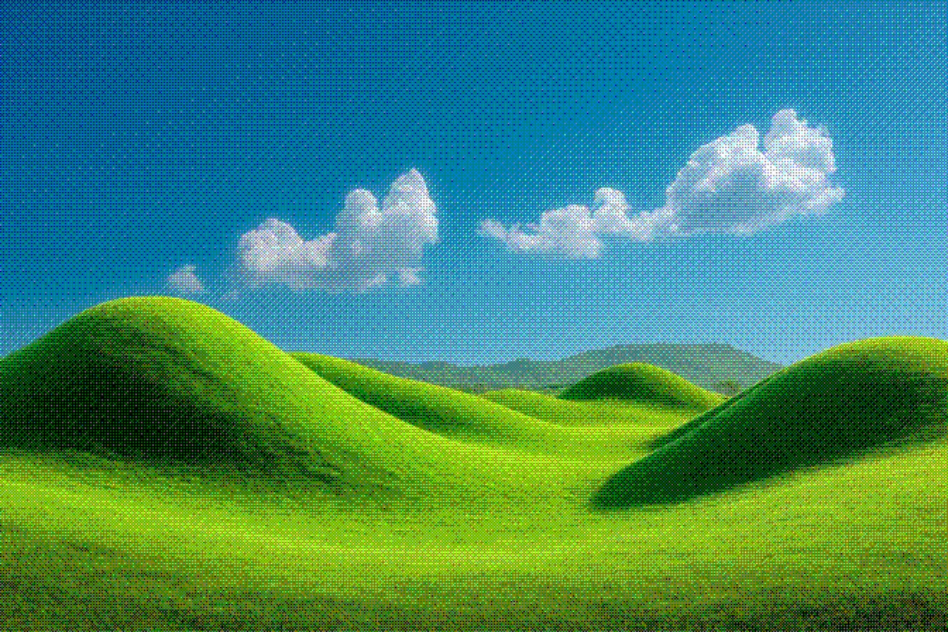 Green hills under a blue sky