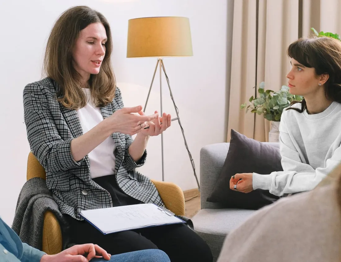 A therapist talking with a client in a calm room