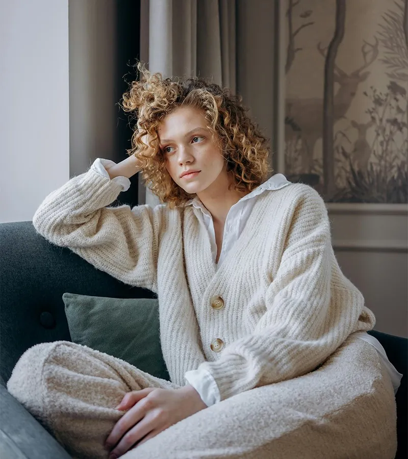 A young woman resting on a sofa