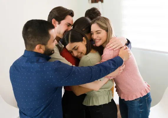 Friends sharing a group hug