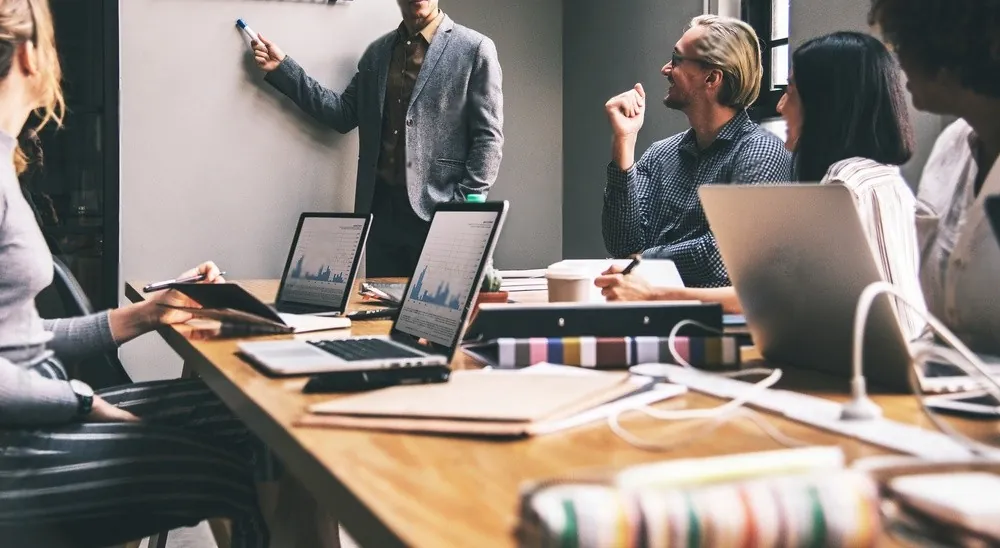 Colleagues working with artificial intelligence tools