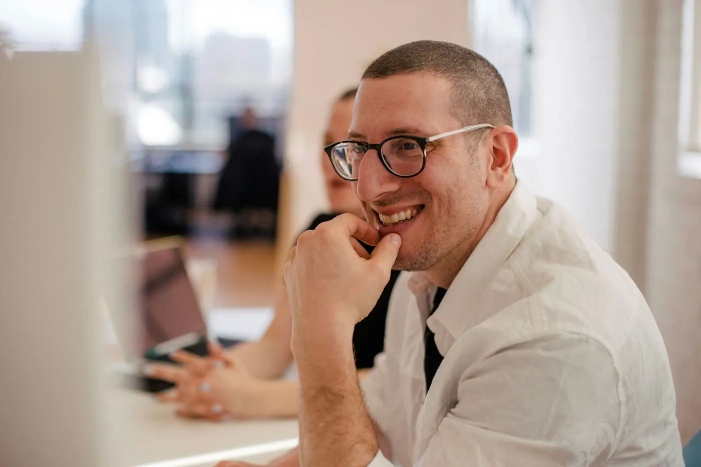 Smiling man at his desk