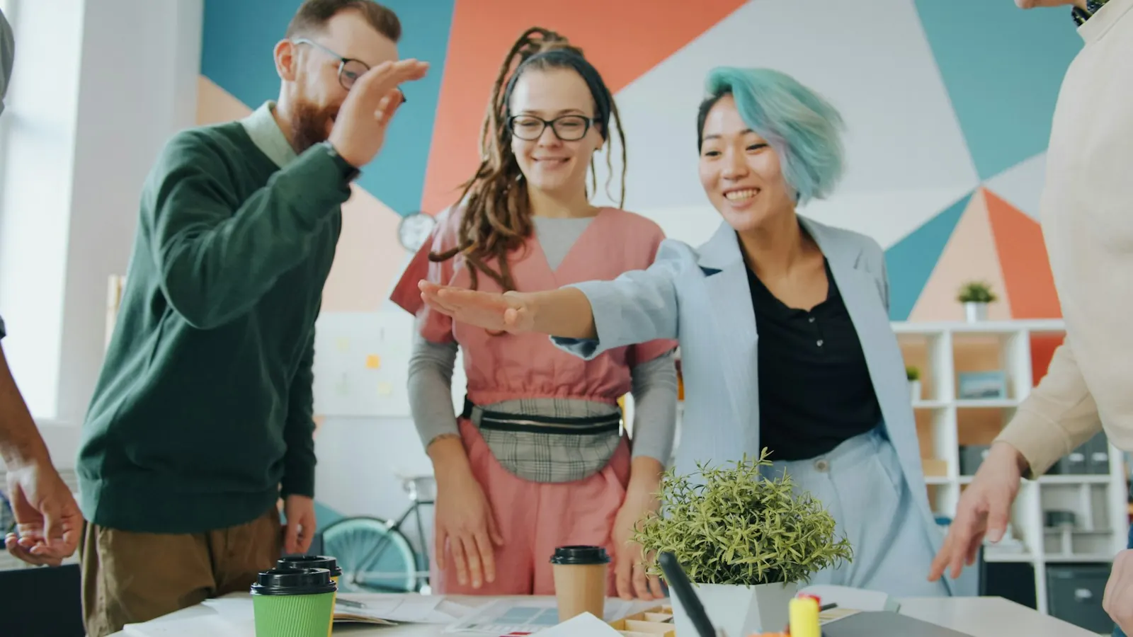 Team laughing together in a colourful office