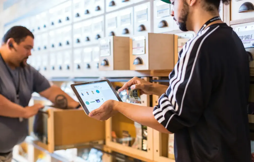Warehouse team checking stock on a tablet