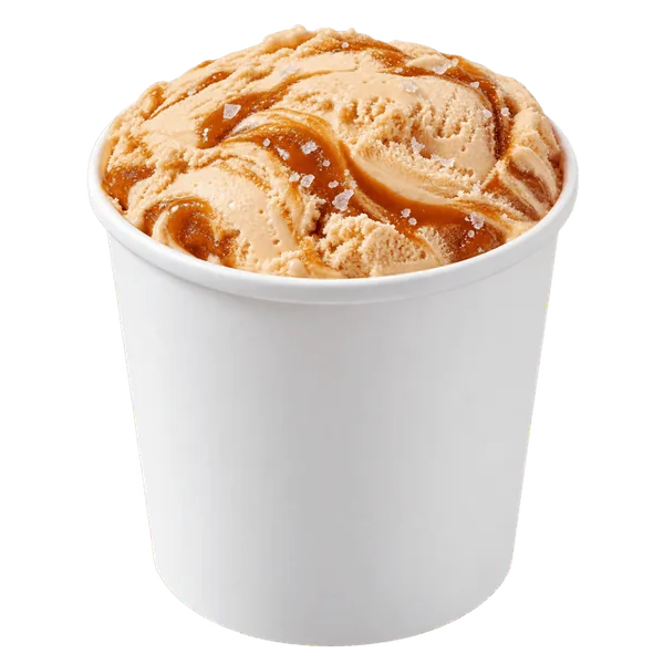 Salted caramel ice cream in an open white take-home pint tub.