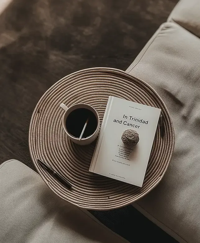 A printed playbook and a coffee on a woven tray