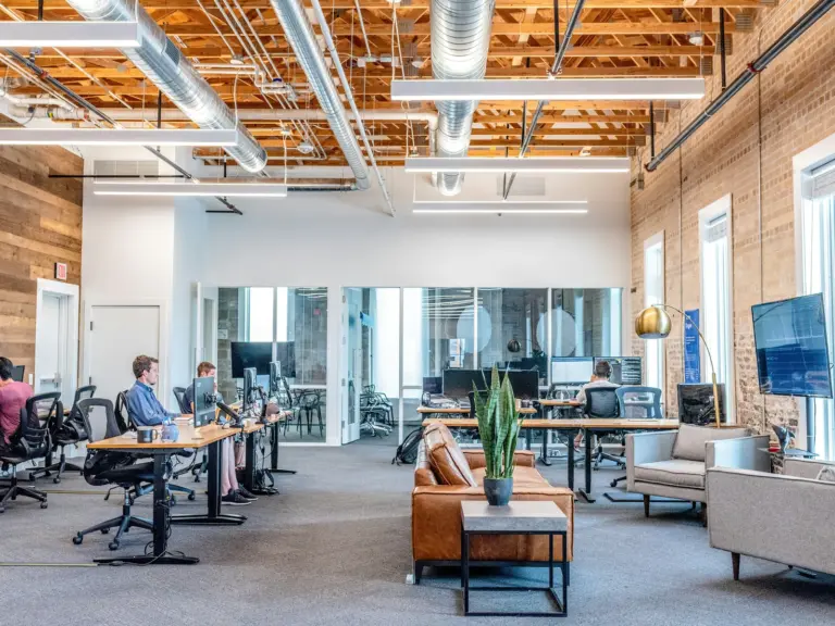An open-plan office with desks and meeting areas