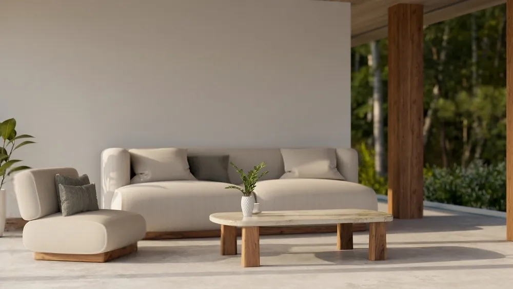 A beige sofa on a covered terrace