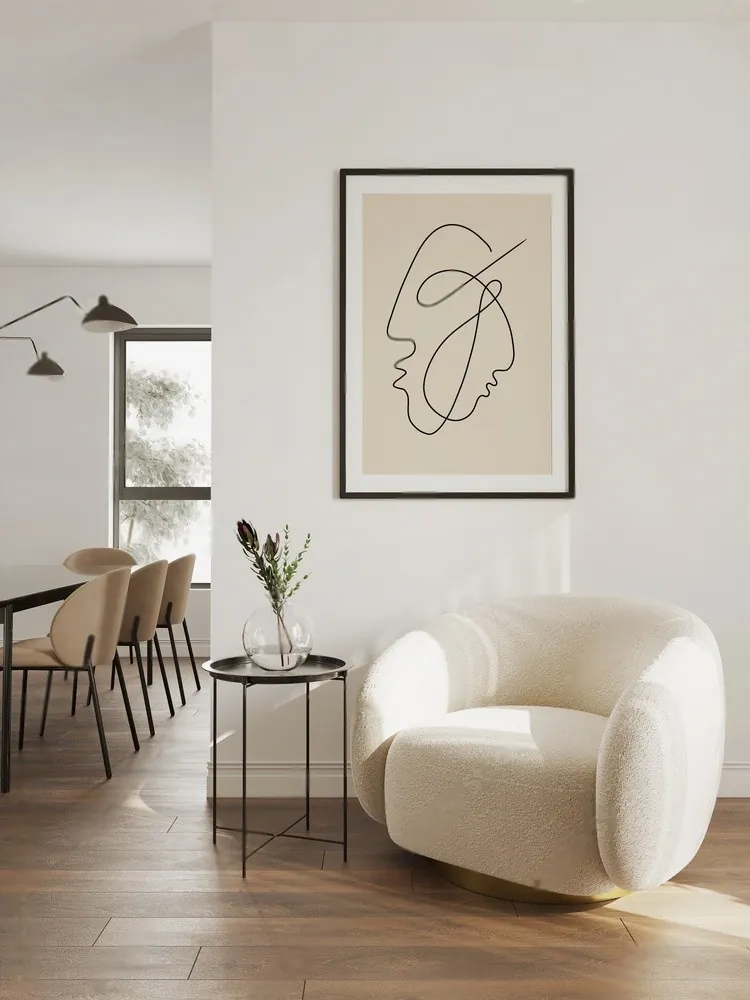 A white armchair under a line drawing