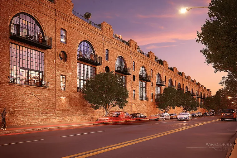 A long brick building with arched windows at sunset