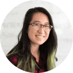 A smiling client with glasses