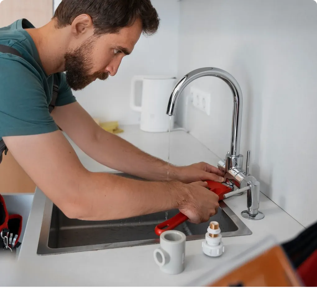 Gullwick technician working on a kitchen tap