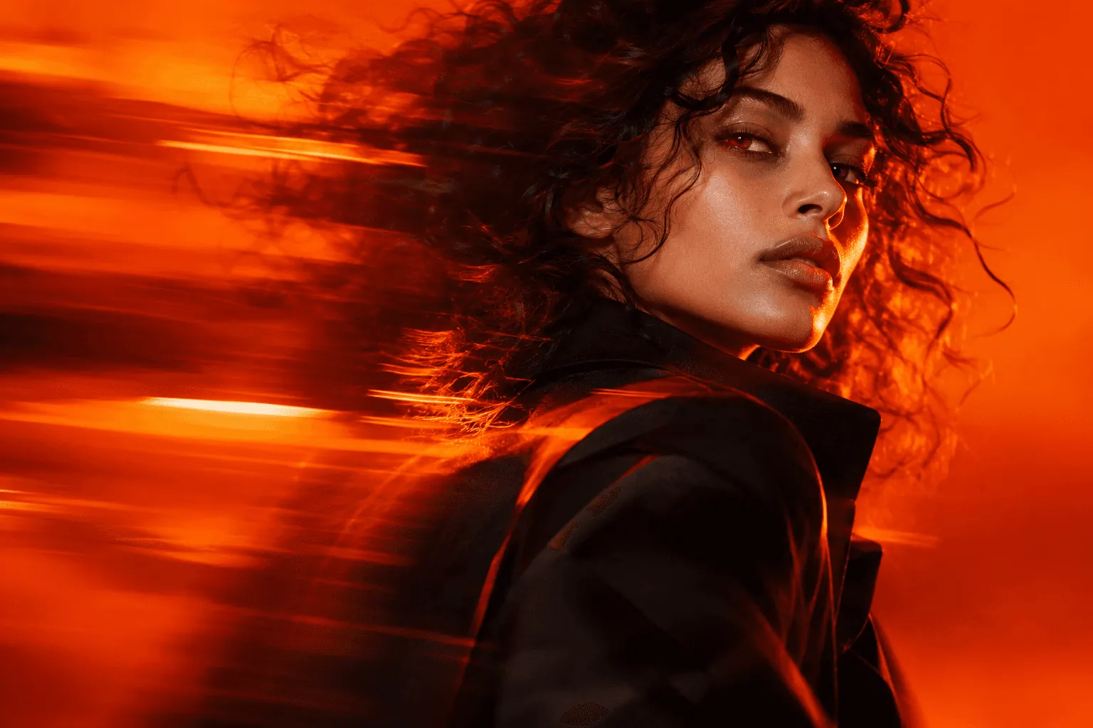 A portrait in vivid orange studio light with horizontal motion trails