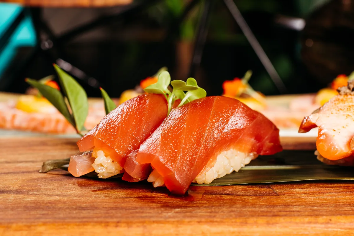 Salmon nigiri on a wooden board