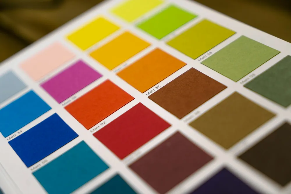 A paint colour chart with squares of yellow, orange, red, blue and green