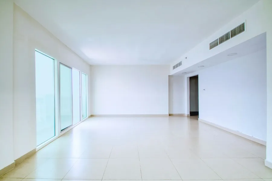 A bright empty room with tiled floors after building work
