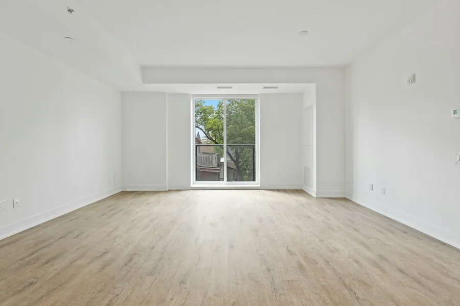 An empty, freshly cleaned flat with pale wooden floors