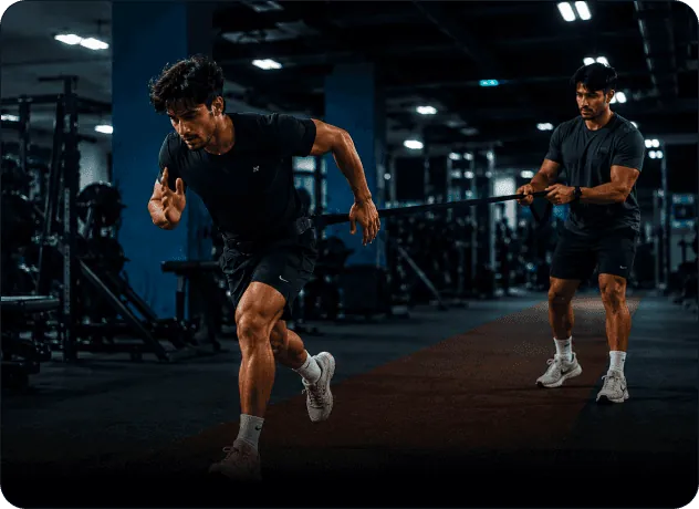 A coach guiding an athlete through a sprint drill