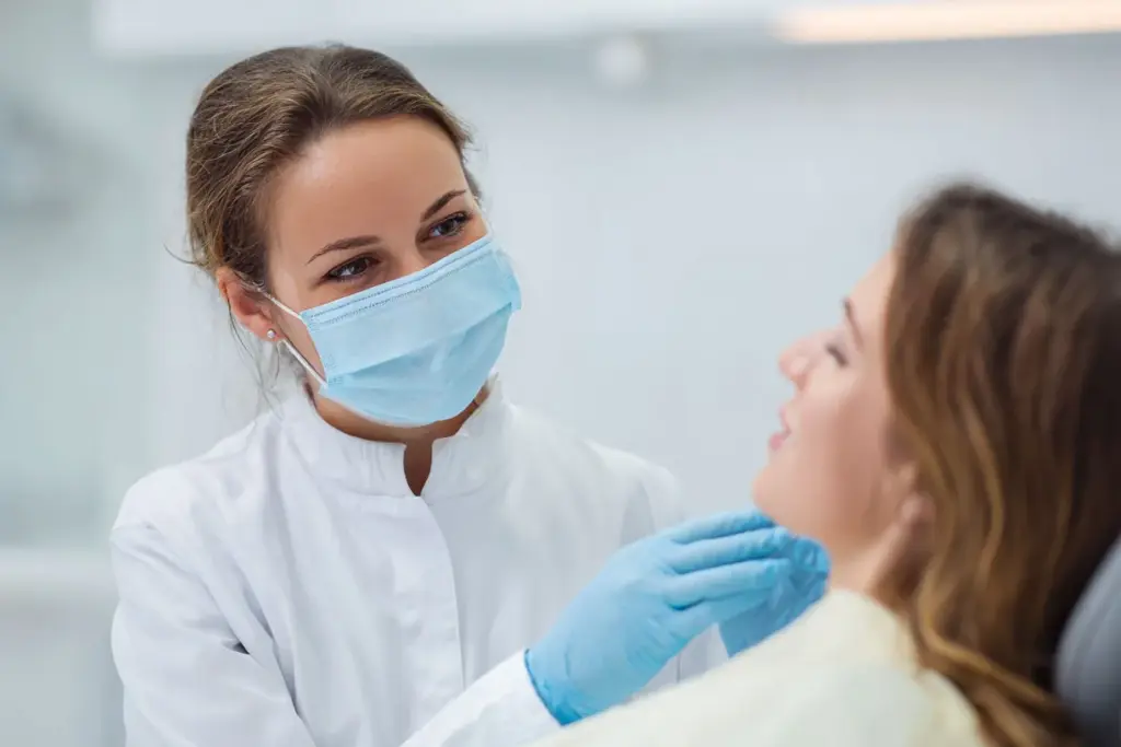 A dentist talking with a patient