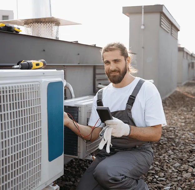 A technician installing an outdoor unit