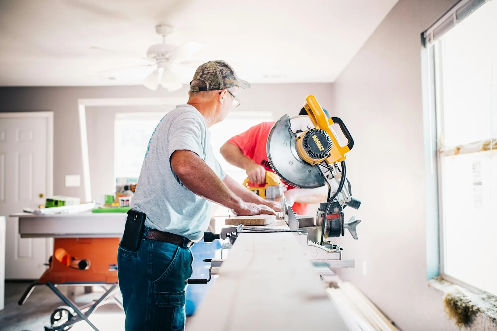 Two Keystead professionals cutting timber on site