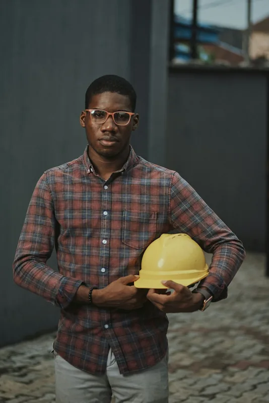 Marcus Reed holding a yellow hard hat