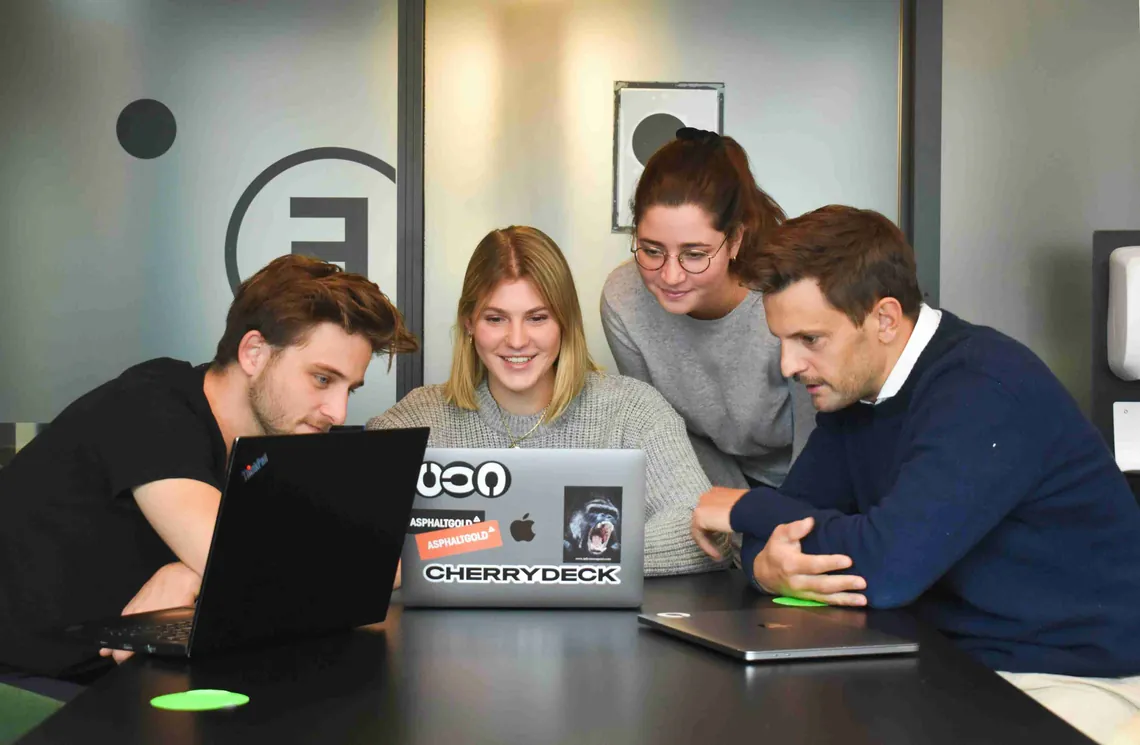 The team around a laptop