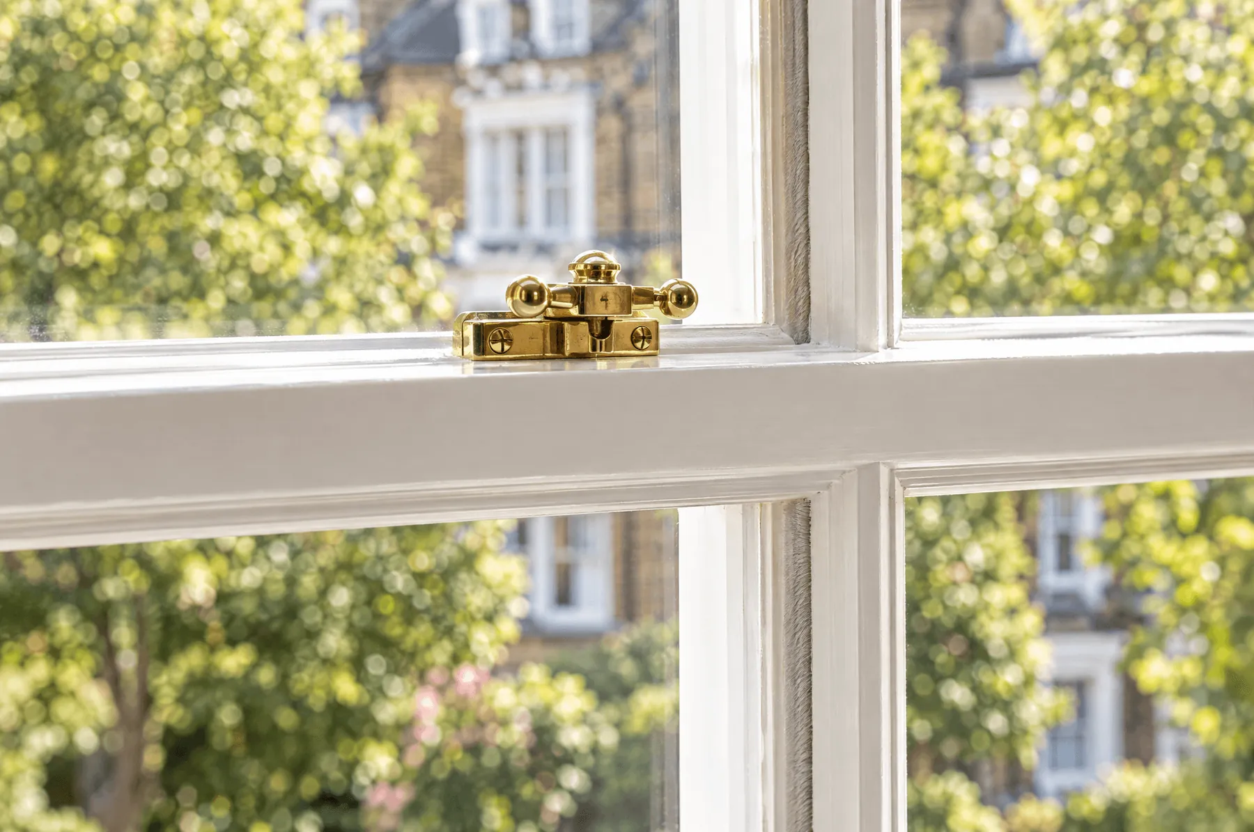 Brass sash lock on a restored window on Mill Street
