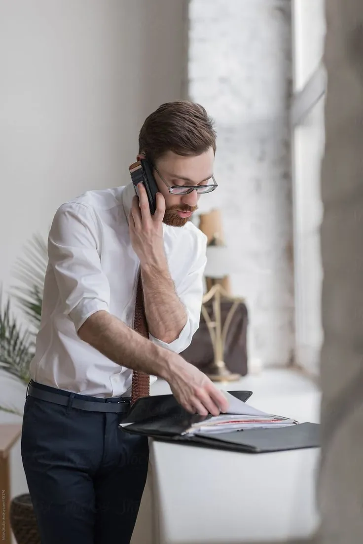 A lawyer on the phone reviewing documents