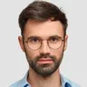A client with a beard and glasses