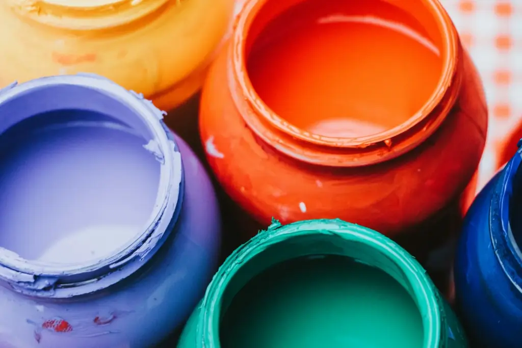 Open pots of bright paint