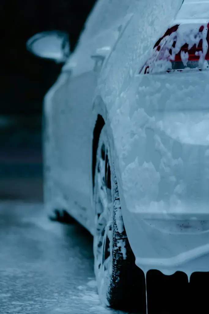 A car covered in foam at the wash