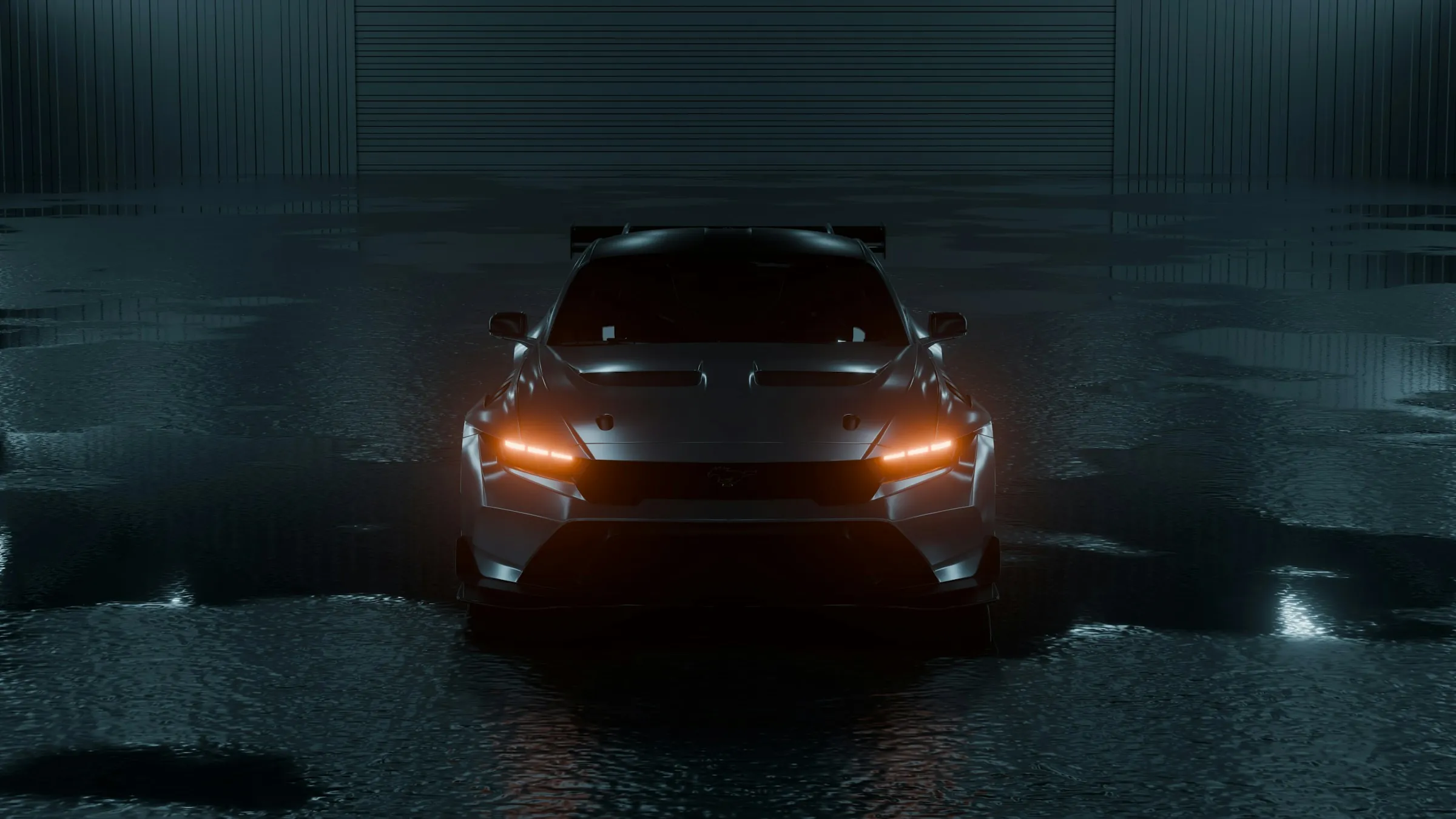 A dark sports car with its headlights on in a dim garage