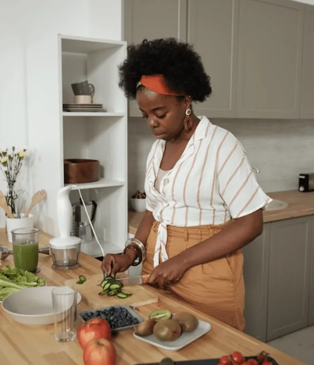 A customer preparing food in a clean kitchen