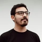 Portrait of a consultant in glasses and a black T-shirt