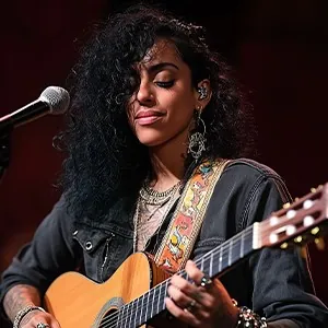 Playing guitar into a microphone