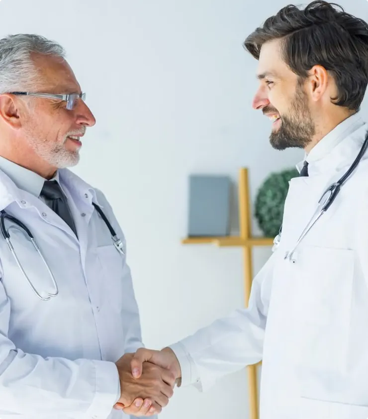 Two doctors shaking hands