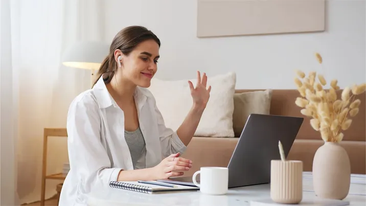A woman on a call with her doctor at home