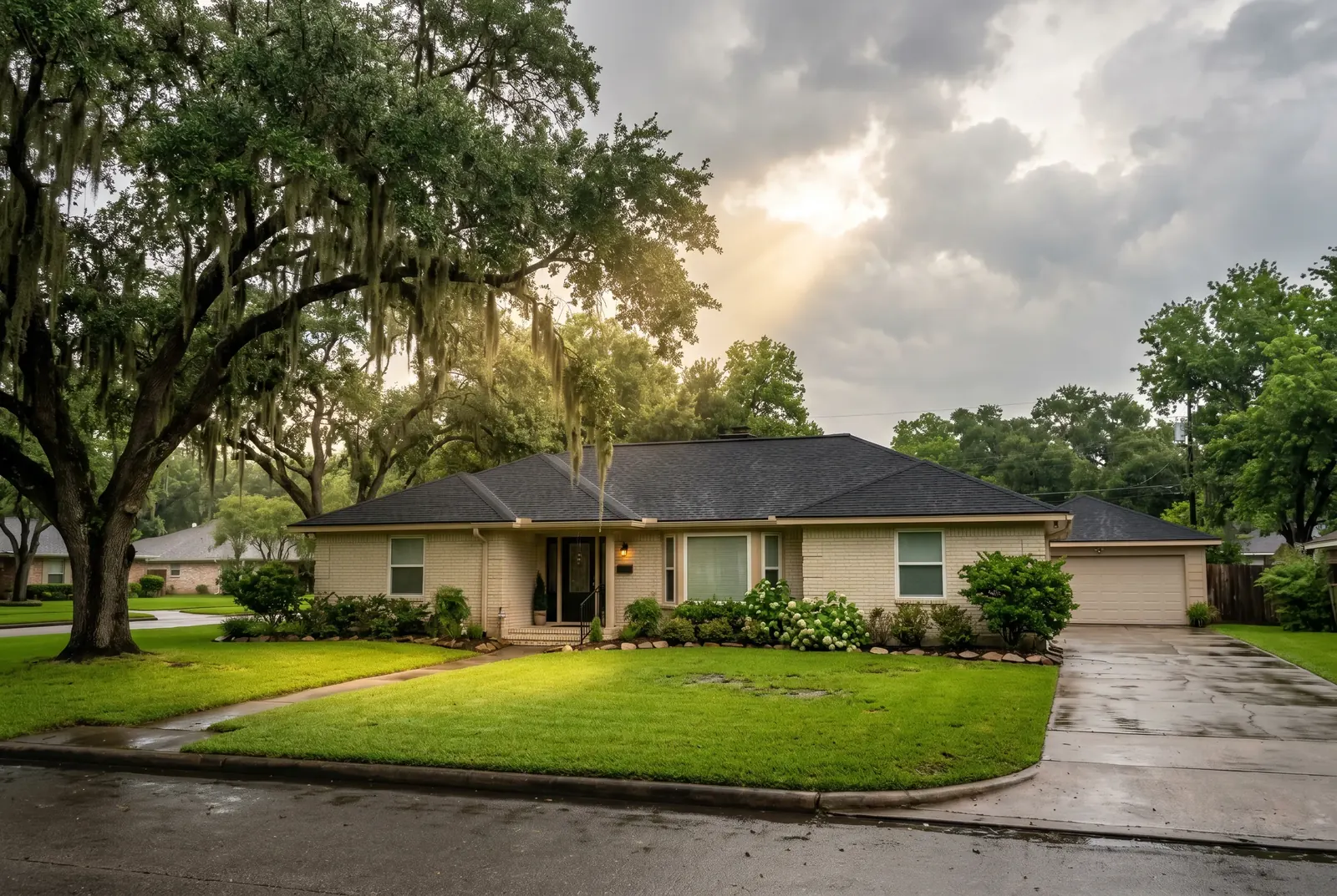 A ranch-style home with a wide lawn and mature trees