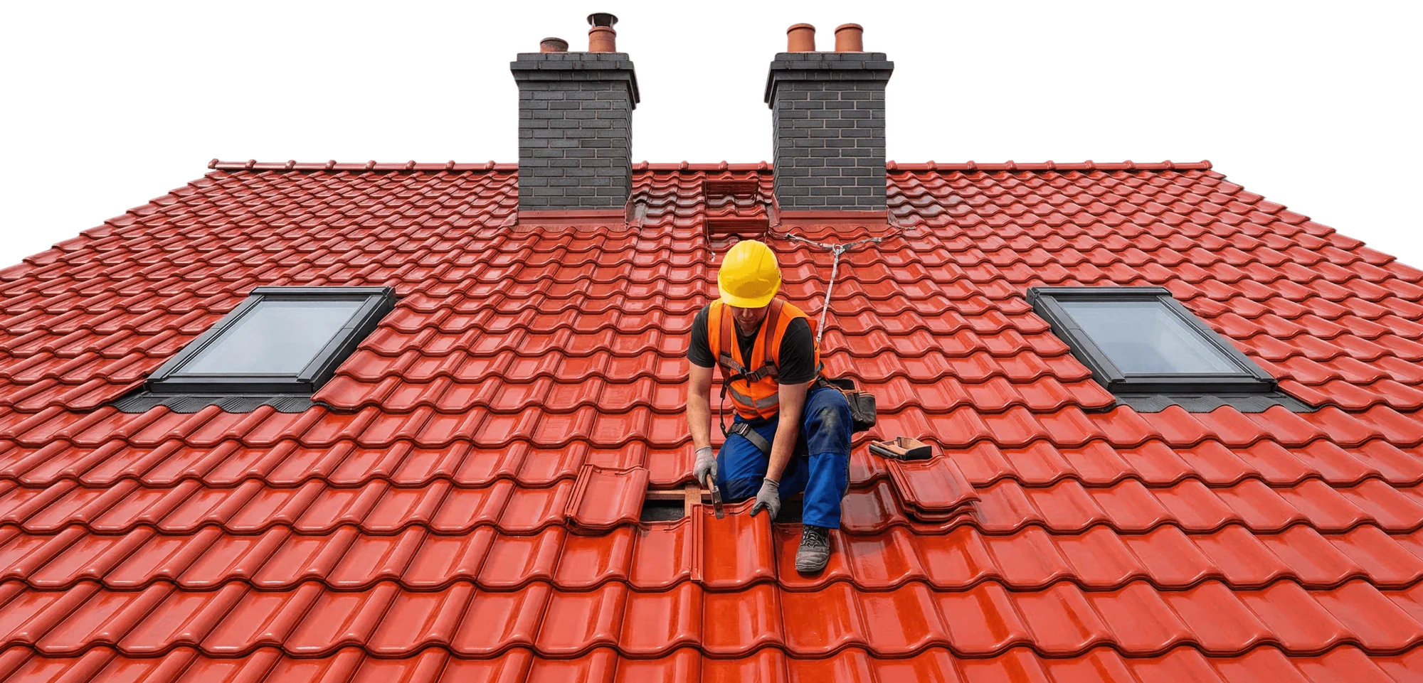A roofer in a hard hat replacing red tiles between two chimneys and skylights