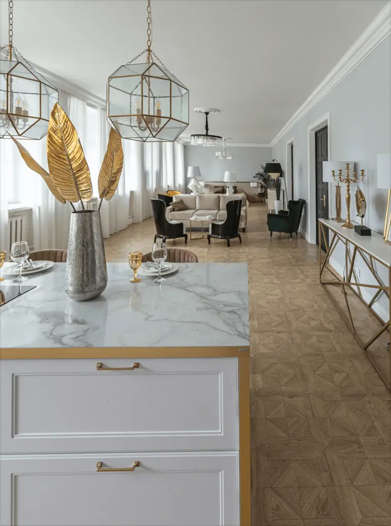 A marble counter with a gold vase in a long dining room