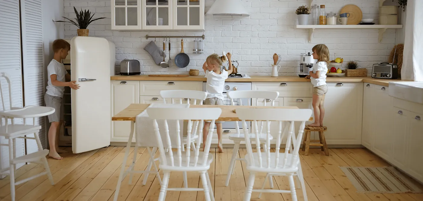 Children helping in a bright family kitchen