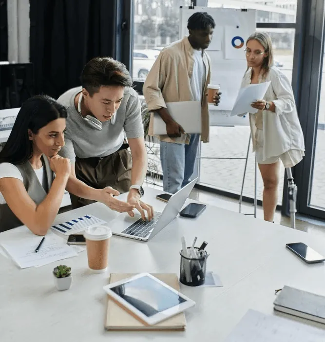 Colleagues working together at a desk