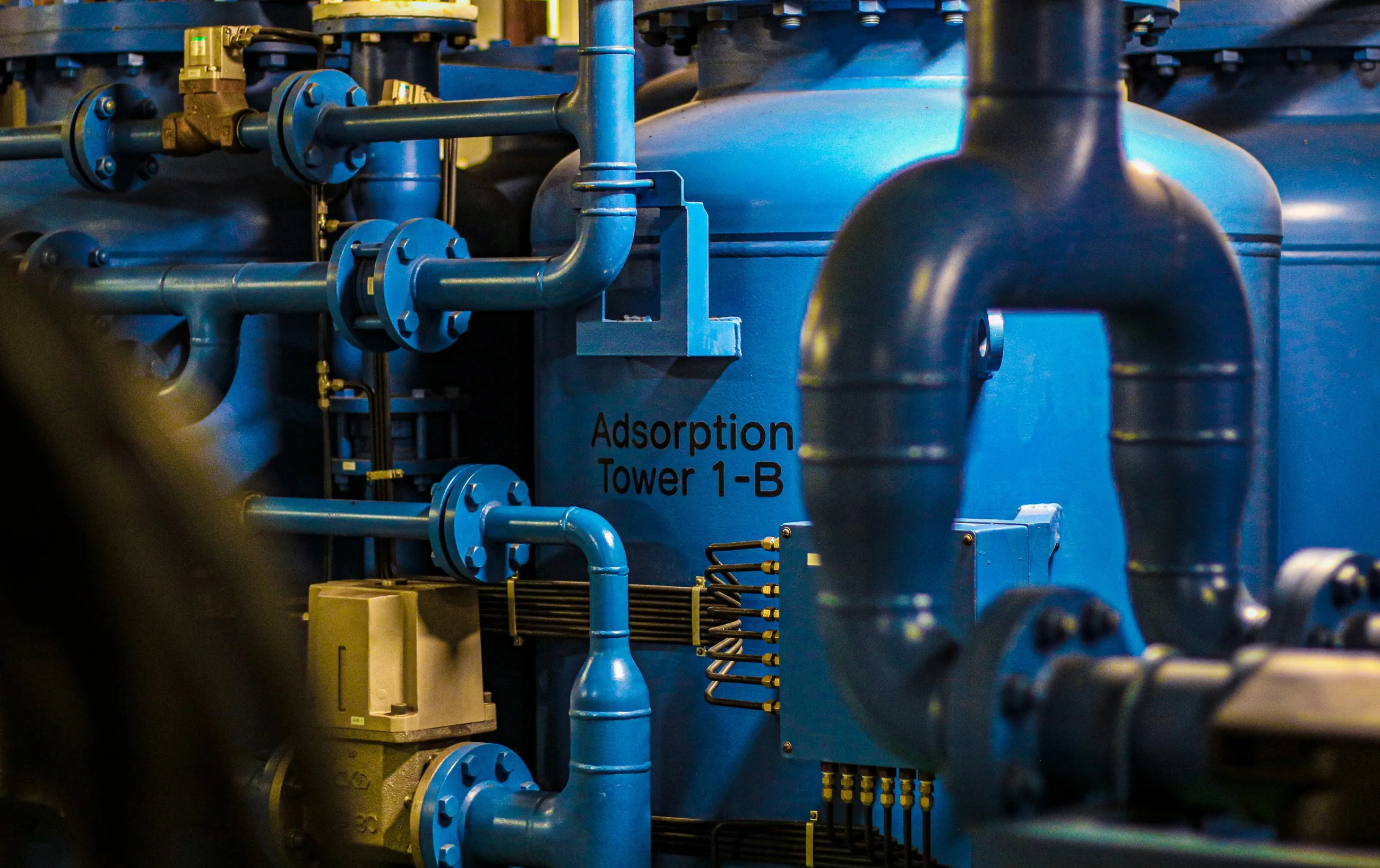 Blue industrial pipes and tanks